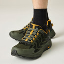 Close-up of men's olive green and black waterproof walking shoes with mustard yellow accents, showcasing cushioned sole, lace system and protective toe cap.