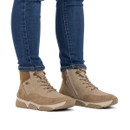 Model wearing beige lace-up ankle boots with faux fur lining, inside zip and comfortable chunky sole.
