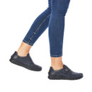 Model wearing navy leather touch-fastening comfort shoes with a lightweight cushioned sole for everyday wear.