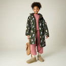 Lifestyle image of the junior waterproof robe worn open, highlighting the cosy borg fleece lining and layered styling.