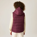 Rear lifestyle image of the junior hooded padded gilet, showcasing the quilted back panels, insulated hood, sleeveless design, and clean finish.