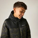 Close-up lifestyle image of the junior insulated hooded jacket, showcasing the high collar, padded hood, contrast yoke, camouflage print, and Regatta chest branding.