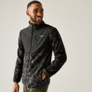 Man wearing a Regatta black and olive camouflage fleece jacket with a full zip, high collar and zipped hand pockets.