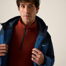 Close-up of a model wearing the Regatta Highton Stretch Padded men's waterproof jacket in Blue/Navy over a fleece mid-layer.