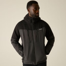Front view of a model wearing the Regatta Men's Highton Stretch Padded Jacket in Ash/Black with hands in the zipped pockets.