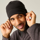 Model adjusting the Regatta Unisex Kingsdale Hat in Black for a comfortable fit.