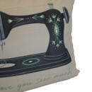 Close-up of the decorative sewing cushion highlighting the vintage sewing machine illustration, textured fabric and charming "Love You Sew Much" printed design.