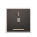 Back of the ceramic art panel showing the integrated fold-out stand and keyhole wall mounting slot.