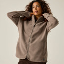 Woman wearing a Regatta women's mocha borg fleece jacket with full zip fastening, high collar and side pockets.
