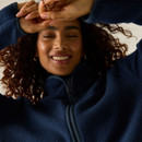 Close-up of a woman wearing the Regatta women's navy borg fleece jacket, highlighting the soft borg fleece fabric.