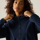 Close-up of a woman wearing the Regatta women's navy longline borg fleece with the half zip fastened.