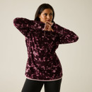 Model wearing the Regatta women's Fig Brushstroke quarter zip fleece with a high collar and quarter zip fastening.
