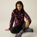 Model wearing the Regatta women's Fig Brushstroke quarter zip fleece, showing the high collar and all-over brushstroke print.