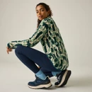 Side view of a model wearing the Regatta women's Pine Camo Print quarter zip fleece, showing the curved hem and all-over print.