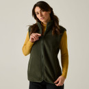 Model wearing the Regatta women's Dark Khaki borg bodywarmer, highlighting the full zip fastening, high collar and side pockets.