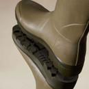 Close-up of Le Chameau Wellington boots showing the textured rubber construction and deep lugged outsole tread.