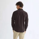 Rear view of a Wrangler long-sleeve western shirt in a dark chocolate brown corduroy fabric, highlighting the western back yoke and classic fit.