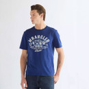 Front view of a Wrangler short-sleeve crew neck T-shirt in a vibrant blue colour, featuring a vintage-inspired Americana graphic with a classic muscle car, Wrangler logo, and garage-themed typography across the chest.