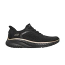 Side profile of the black Skechers BOBS Squad Slip-ins trainer with metallic side logo, knitted upper, gold-tone trim and chunky black sole.