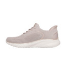 Side profile of the natural beige Skechers trainer with a knitted upper, supportive heel design, metallic trim and white cushioned sole.