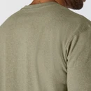 Close-up rear view of a green Carhartt T-shirt showing the neckline, shoulder seams and fabric texture.
