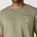 Close-up of a green Carhartt T-shirt showing the ribbed crew neckline, chest pocket and signature logo patch.