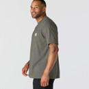 Side view of a model wearing a dark grey-green Carhartt short-sleeve pocket T-shirt with logo patch.