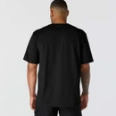 Rear view of a man wearing a black Carhartt short-sleeve T-shirt with a relaxed fit.