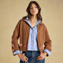 Closer front view highlighting the cardigan’s relaxed fit, collared neckline, button fastening and floral knit pattern.