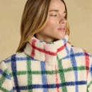 Close-up highlighting the cosy high collar and soft borg texture in the colourful check design.