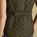 Close-up showcasing the adjustable back waist tabs and branded popper fastenings.