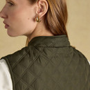 Close-up highlighting the quilted stand collar and subtle Joules embroidery at the back.