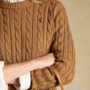 Close-up showcasing the classic cable knit texture and signature embroidered Joules hare.