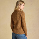 Back view highlighting the all-over cable knit design, ribbed hem and classic crew-neck silhouette.