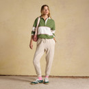 Full-length styling shot showing the deck shirt paired with relaxed joggers, trainers and a shoulder bag.