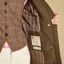Interior view showcasing the quilted lining, internal pocket and heritage-inspired branding.