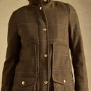 Close-up showcasing the checked fabric, structured silhouette and practical front patch pockets.