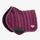 Berry LeMieux close contact saddle pad with large square quilting, contrasting rope trim, black girth protection panel and branded badge on a white background.