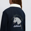Close-up rear view of the LeMieux children’s navy polo top showing the embroidered horse head and “Not Just a Hobby” design.