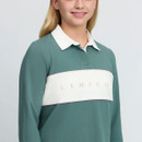 Close-up of the green LeMieux equestrian polo top showing the white collar and white chest panel with pale pink LeMieux branding and piping.