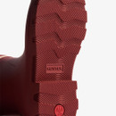 Close-up of the textured tread sole on a Hunter Downpour short wellington boot in merlot red with embossed Hunter branding.