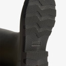 Close-up of the black rubber sole of a Hunter Boot with textured traction pattern and brand logo.