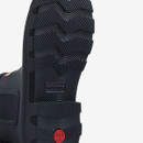 Black rubber boot sole with textured pattern and "HUNTER" branding visible.