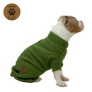 Brown and white dog modelling a green Snug Fit knitted dog jumper with roll neck, short sleeves and branded patch against a white background.