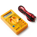 Yellow digital multimeter with rotary selector dial, LCD display and red and black electrical test leads.