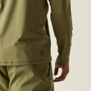 A close-up of a person's arm wearing an olive-green long-sleeve top and matching trousers.