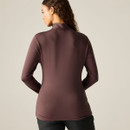 A woman wearing a long-sleeve, high-neck, burgundy top from Dare 2b, viewed from the back.