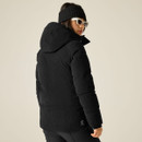 Rear view of woman wearing a black Dare 2B padded cord jacket with large hood.