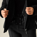 A black cord jacket with zip and snap closures, featuring two front pockets and a quilted interior.