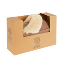 A pair of mink-coloured slippers with a faux fur lining, presented in a cardboard box.